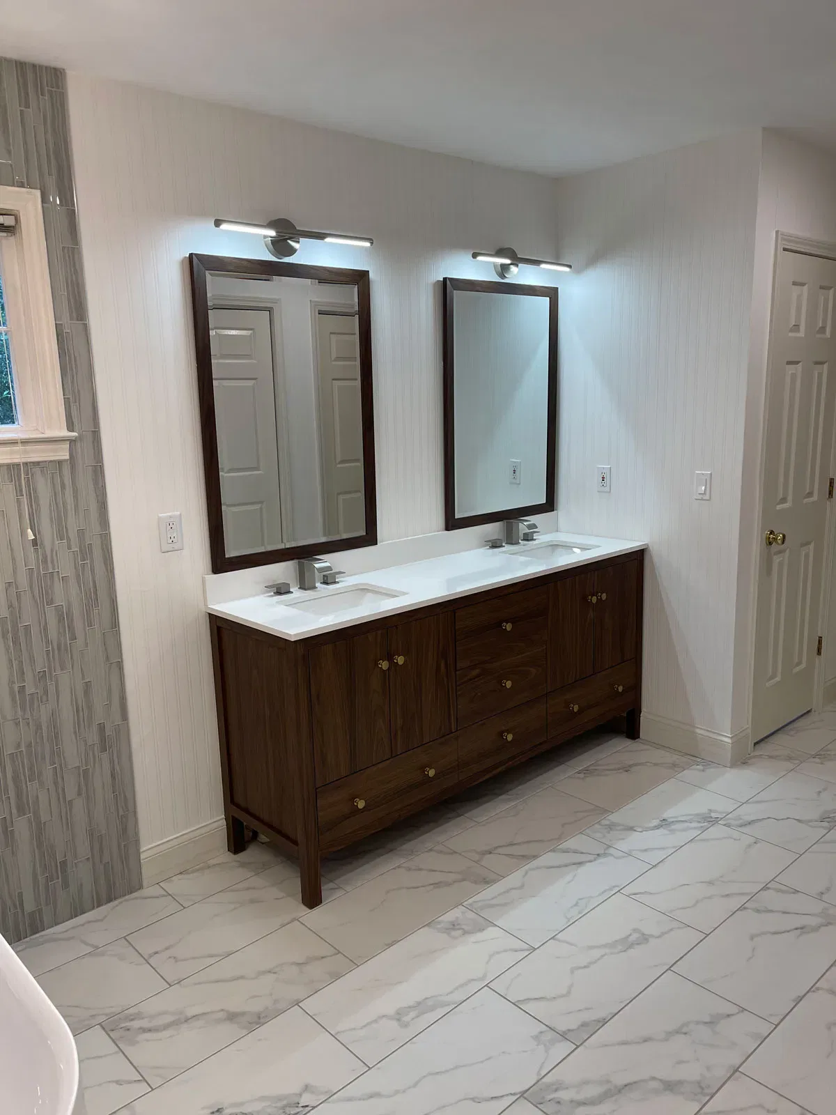 Elegant modern bathroom with double vanity and mirrors